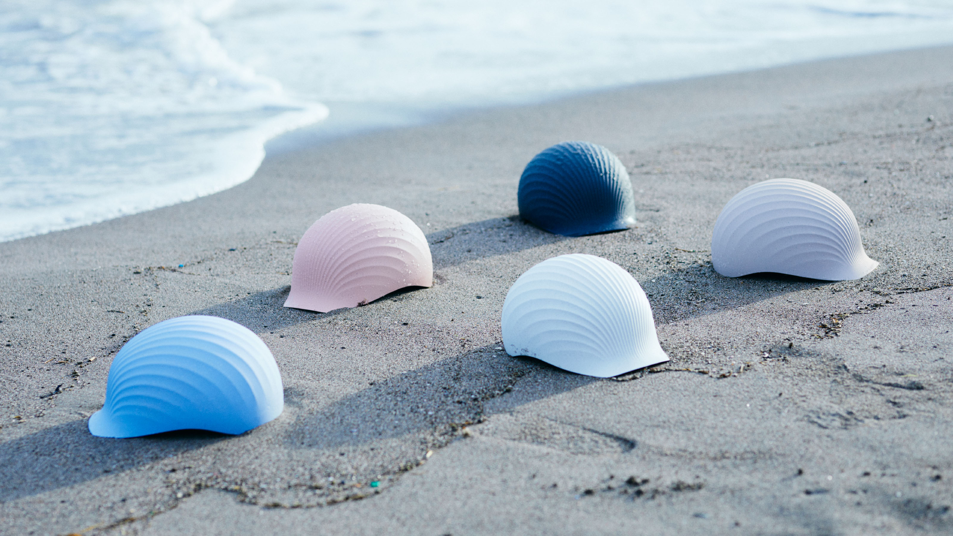 Shellmet helmets on a beach