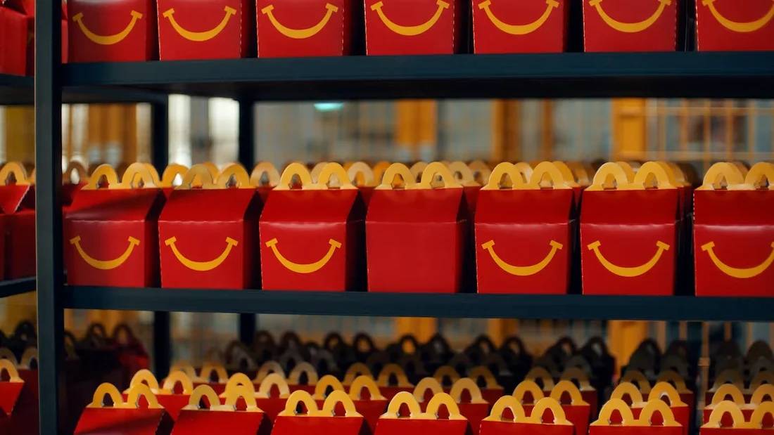 Fabrica-comercial-de-McDonalds-creado-por-TBWA-Buenos-Aires-0-30-screenshot A row of happy meal boxes for McDonald's, one with a smile missing