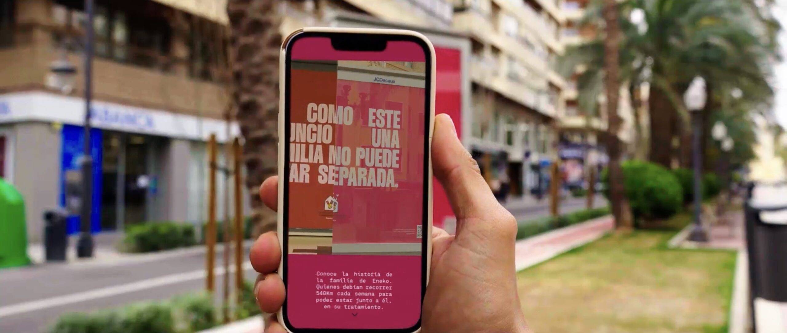 Screenshot A mobile phone scans a billboard, revealing more