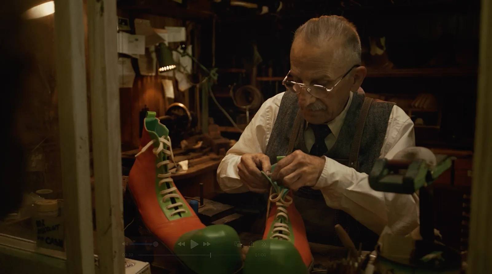 A man working on clown shoes