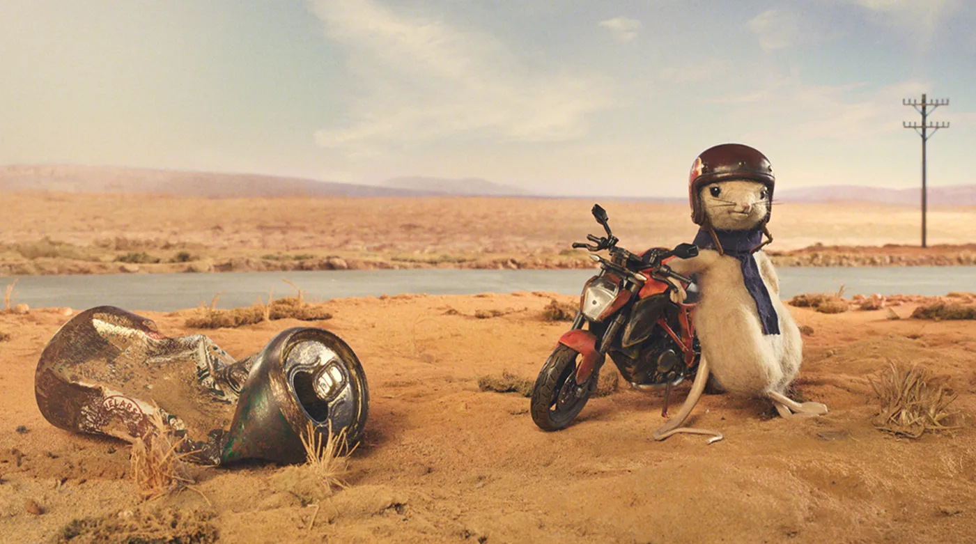 Telstra-Better-on-a-Better-Network-Bear-Meets-Eagle-on-Fire-1 An animal with a motorcycle in the Australian desert